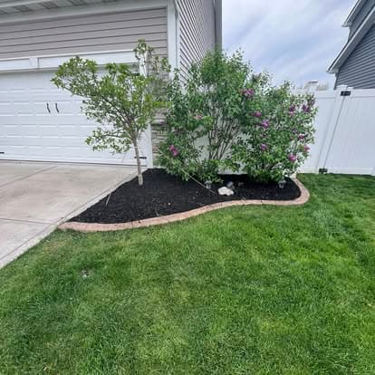 Meeks Mowing & Landscaping — fresh mulch bed installation